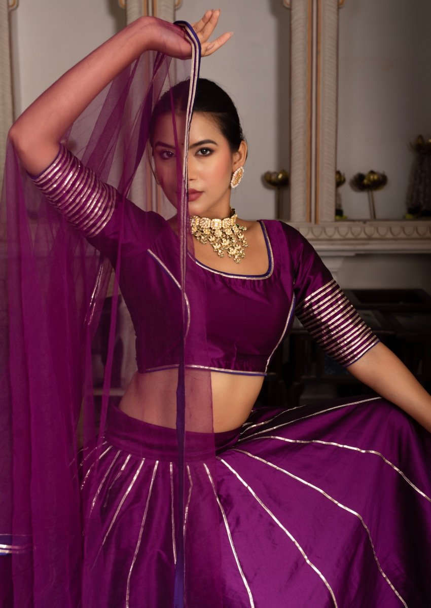 GULABI GALYIAN SEERAT PLUM TAFFETA SILK GOTA PATTI LEHENGA SET WITH SOFT NET DUPATTA - Pomcha Jaipur