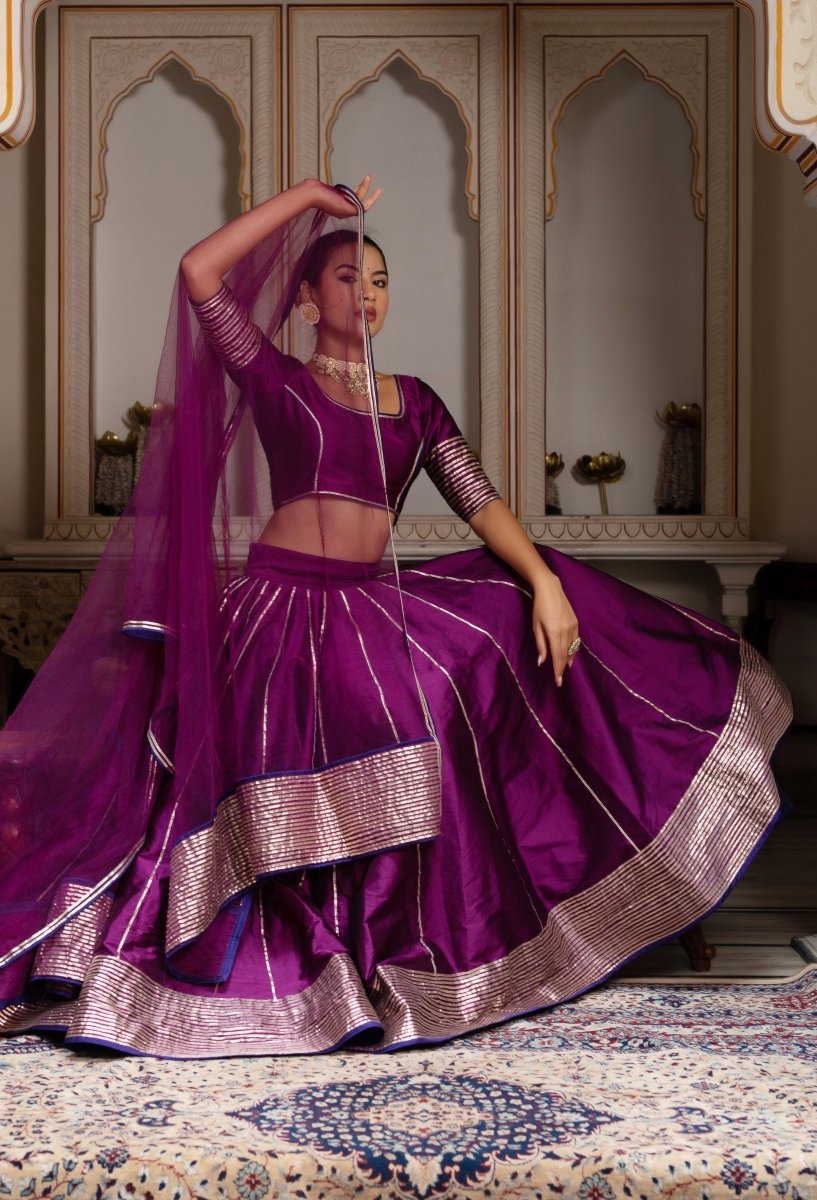 GULABI GALYIAN SEERAT PLUM TAFFETA SILK GOTA PATTI LEHENGA SET WITH SOFT NET DUPATTA - Pomcha Jaipur