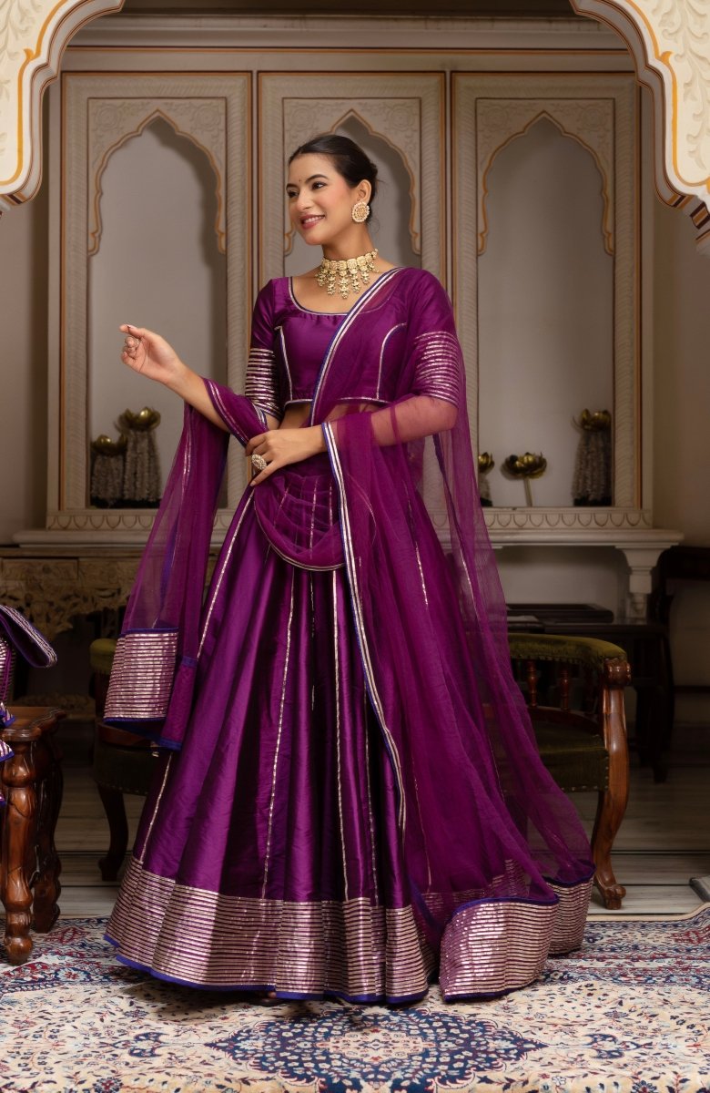 GULABI GALYIAN SEERAT PLUM TAFFETA SILK GOTA PATTI LEHENGA SET WITH SOFT NET DUPATTA - Pomcha Jaipur