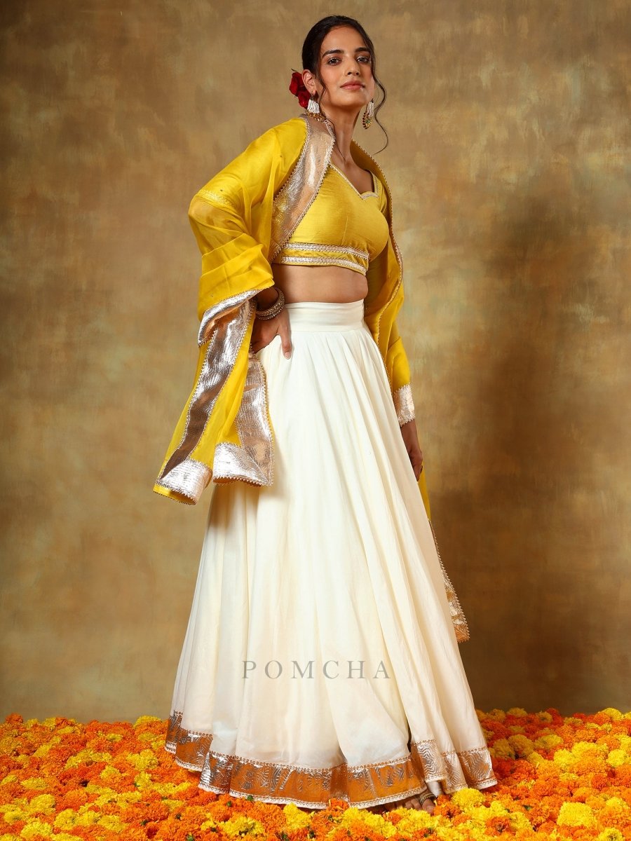 GUZARISH YELLOW OFF WHITE COTTON SILK LEHENGA WITH ORGANZA DUPATTA SET - Pomcha Jaipur