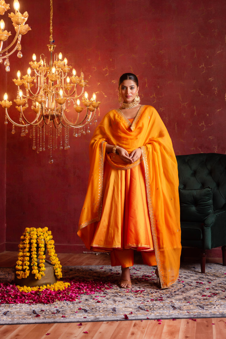 GULFIZAN SAFFRON RADIANCE TAFFETA ANARKALI SUIT SET WITH ORGANZA AARI TAARI WORK DUPATTA